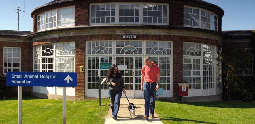 The Queen's Veterinary School Hospital woman, man, dog, building